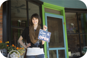 Commercial Insurance Woman Holding Open Sign